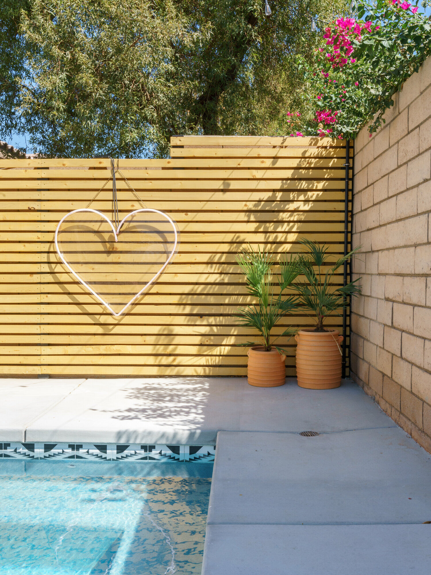 Backyard patio with terracotta accents at Terra Luz